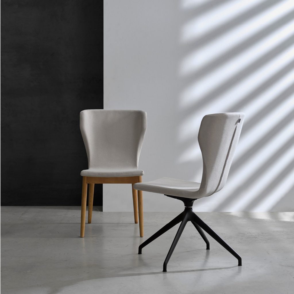 Nies armchair with swivel base and armrests